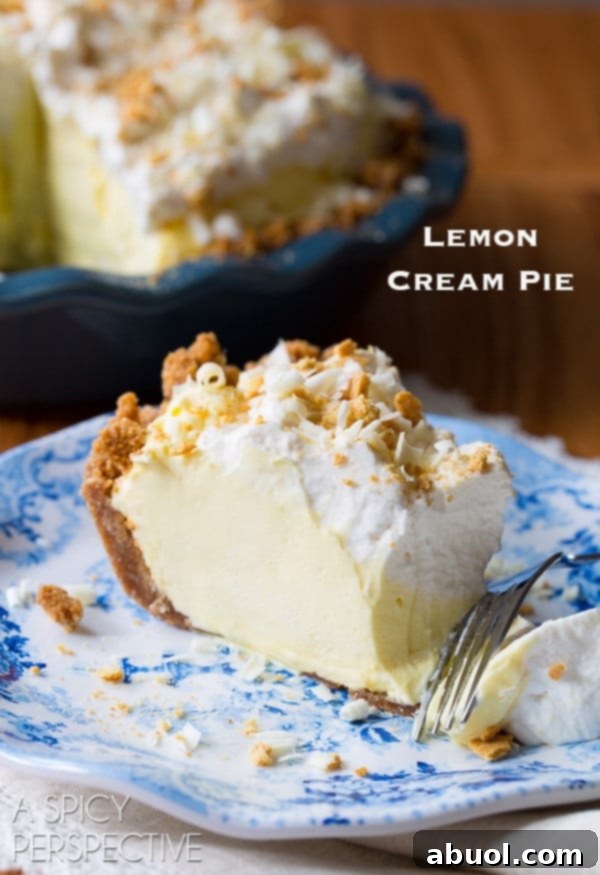 Slice of lemon cream pie on a plate with the words "lemon cream pie" in the corner, a final delicious visual.