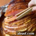 Must-Make Apple Stuffed Baked Ham with Honey Mustard Glaze on ASpicyPerspective.com #ham #easter #holiday #thebest