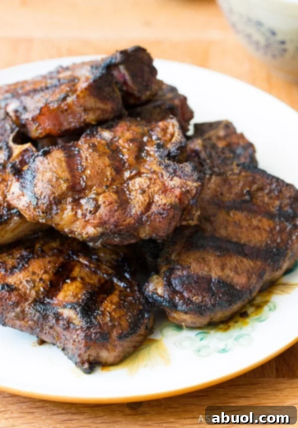 Grilled Lamb Chops stacked on a platter
