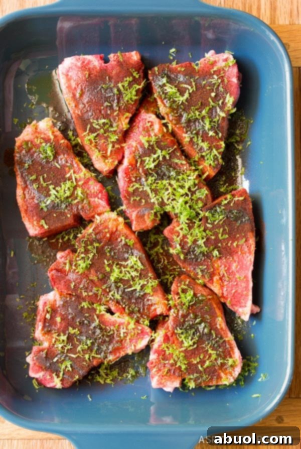 Chipotle Lime Grilled Lamb Chops marinating in baking dish