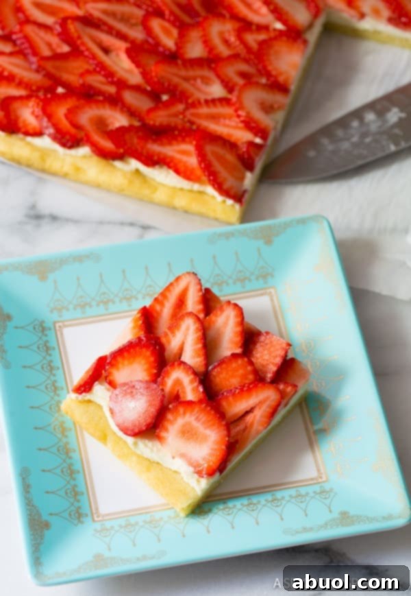 Two slices of strawberry pizza on a serving plate