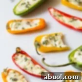 Flavorful Stuffed Mini Pepper Poppers 9 3-Ingredient Mini Stuffed Peppers Recipe on ASpicyPerspective.com - So good!