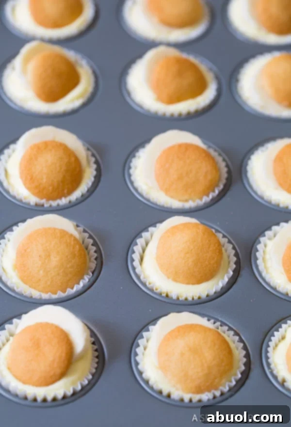 Mini Banana Cream Pies ready to be enjoyed, peeled from liners