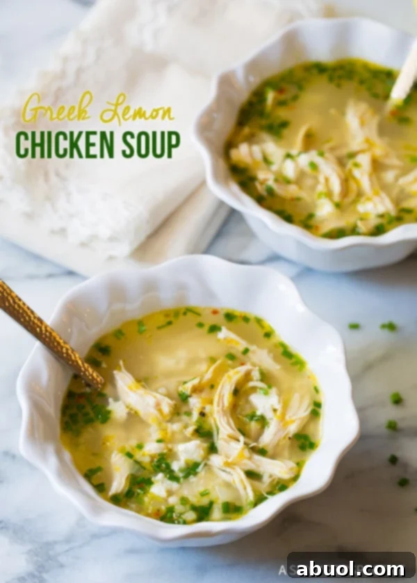 Two steaming bowls of vibrant Greek Lemon Chicken Soup, garnished with fresh herbs, ready to be enjoyed on a kitchen counter.