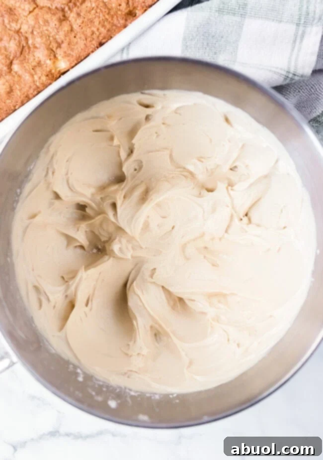 salted caramel frosting in bowl of a mixer. 
