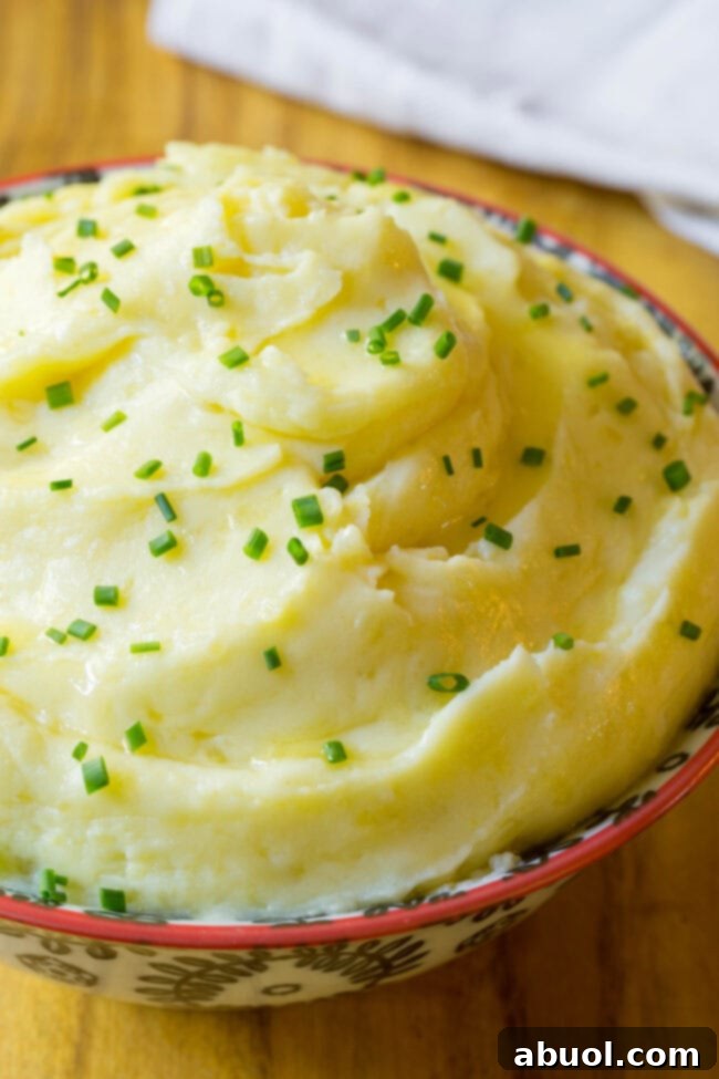 Small bowl full of the best mashed potatoes ready to be served.