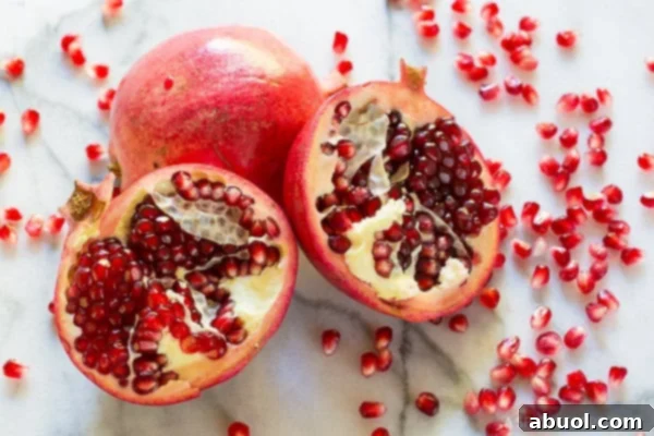 pomegranates opened exposing arils