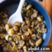 BEST Sautéed Mushroom Recipe for topping steaks or risotto on ASpicyPerspective.com
