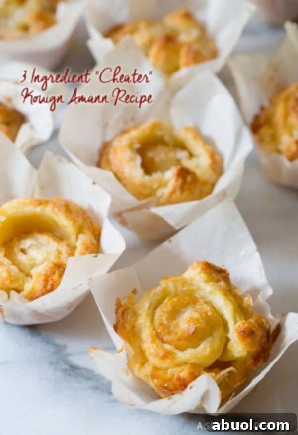 Kouign Amann pastries in little parchment paper squares, showcasing their golden, caramelized crusts.