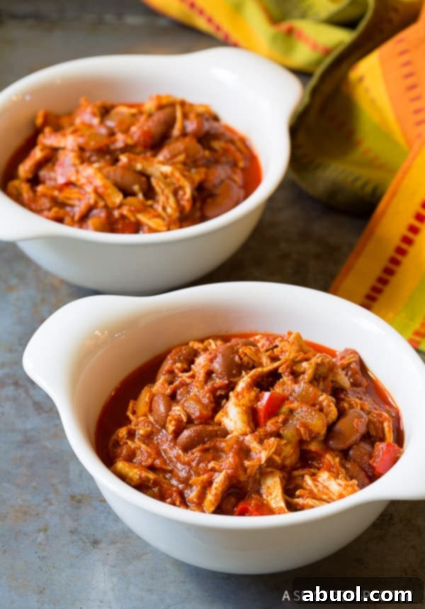 Roasted Red Pepper Crockpot Chicken Chili 9 Two white bowls or roasted red pepper chicken chili.