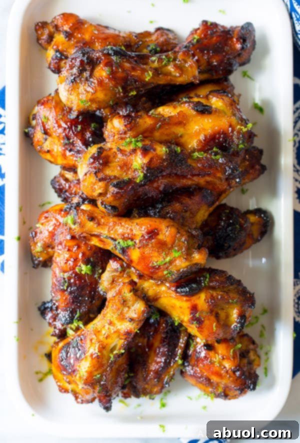 Perfectly Baked Chicken Wings Top down view of a white rectangular dish loaded with baked chili lime chicken wings, ready to serve.