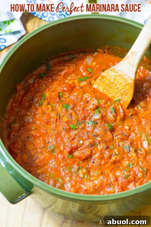 A vibrant green pot filled with steaming, perfect homemade marinara sauce, ready to be served or bottled.