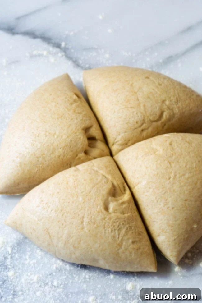 Separate the dough into 4 equal spaces