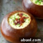 Best Irish Beer Cheese Soup Recipe, a creamy delight for Saint Patrick's Day or any occasion, often served in bread bowls.