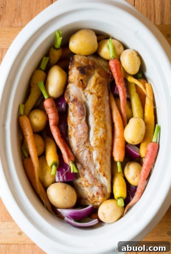 How to Make Slow Cooker Pork Loin - pork tenderloin and carrots in crockpot