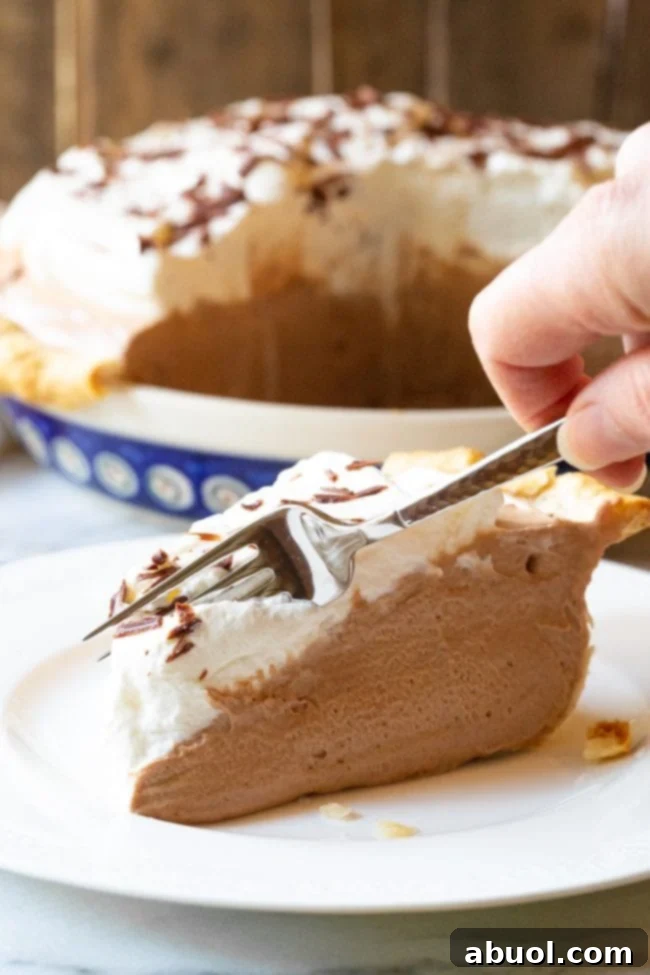 Best french silk pie with fork cutting the first bite