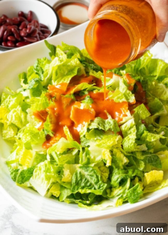 Freshly chopped romaine lettuce, the crisp base for a healthy and hearty taco salad.