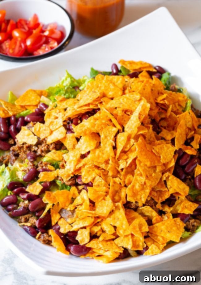 A bowl of sliced black olives, ready to add their distinct savory flavor to the taco salad.