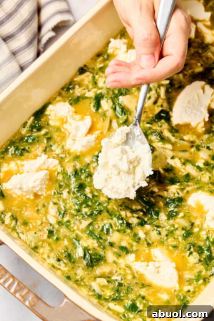 Artichoke Egg Casserole mixture poured into a baking dish