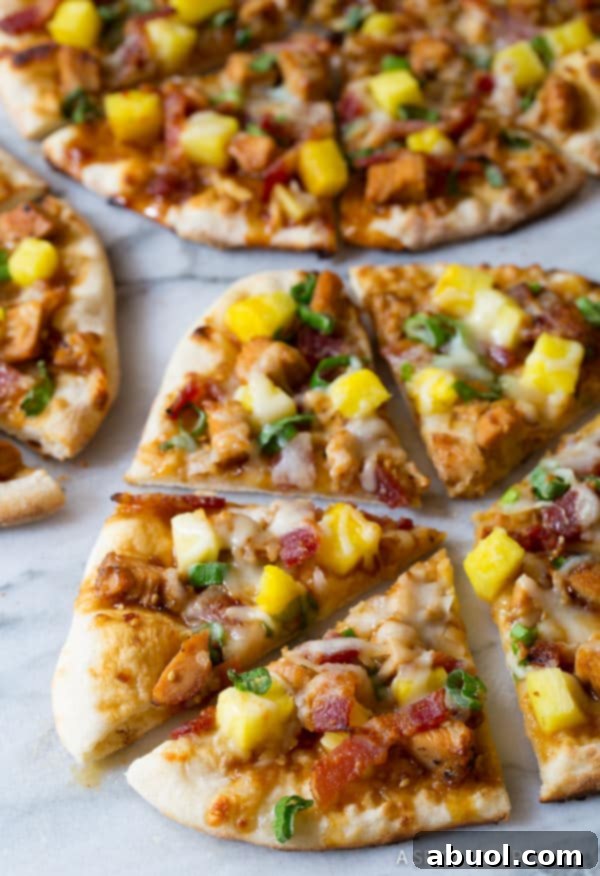 A stunning close-up shot of a golden-crusted Teriyaki Pizza, showcasing generous slices of chicken, glistening pineapple, and perfectly melted cheese, ready to be enjoyed.