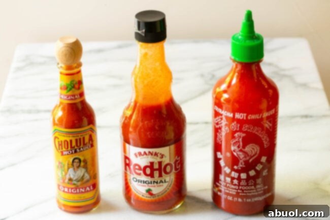 How sauces lined up on a marble table. 