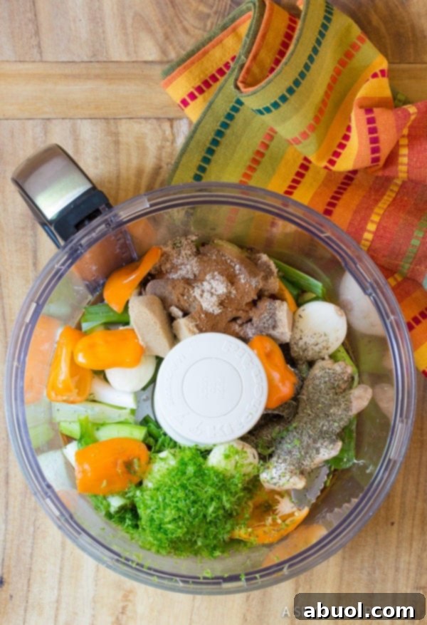 Ingredients for Jamaican jerk marinade in a food processor, ready to be blended.