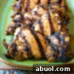 Small thumbnail of grilled jerk chicken thighs.