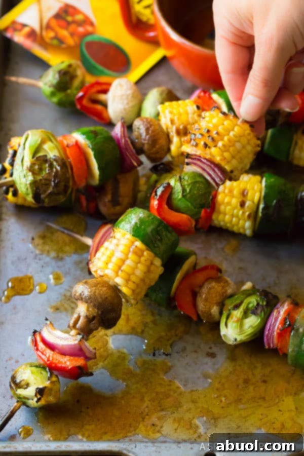 Close-up of vibrant summer vegetables ready for grilling, showcasing their fresh colors and textures before being threaded onto skewers.