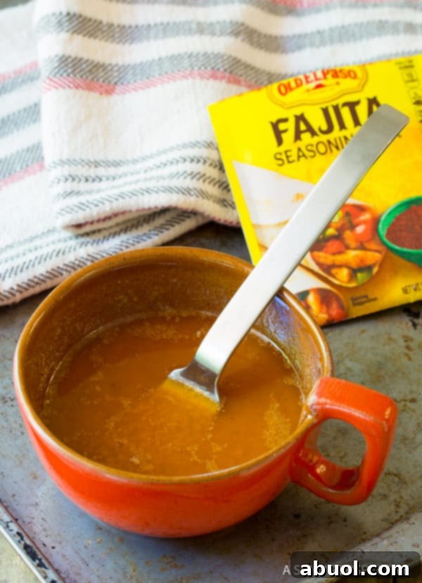 Close-up of the smooth, zesty Fajita Butter mixture, ready to be brushed onto grilled vegetables, highlighting its texture.