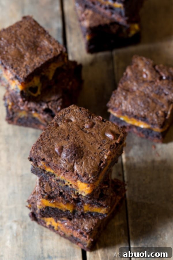 Caramel brownies with crispy tops on a table, ready for serving.