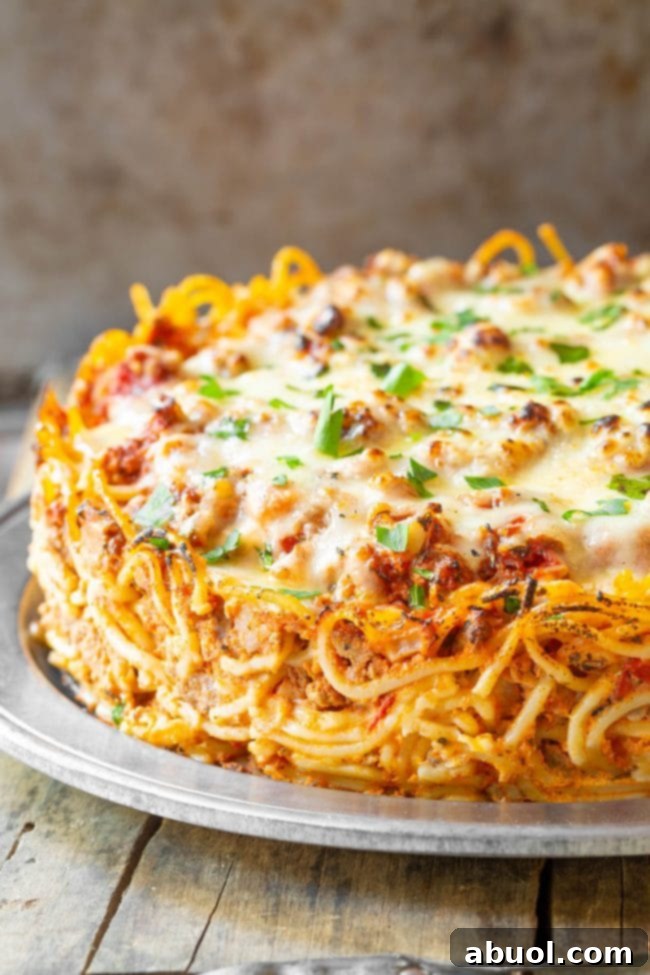 A beautifully presented retro baked spaghetti pie, golden brown and ready to be served, perfect for a cozy family dinner.
