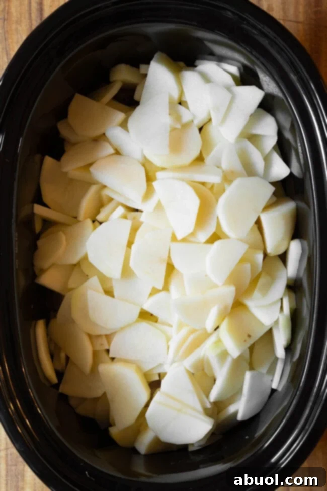 overhead view of potatoes in a slow cooker