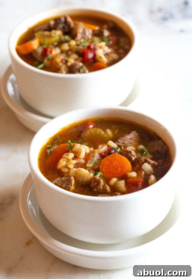 Beef soup with barley served in individual cups, perfect for a cozy meal
