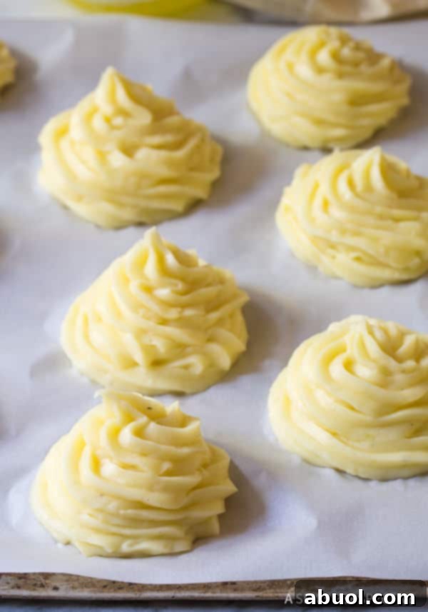 Duchess Baked Potato Recipe piped on baking sheet