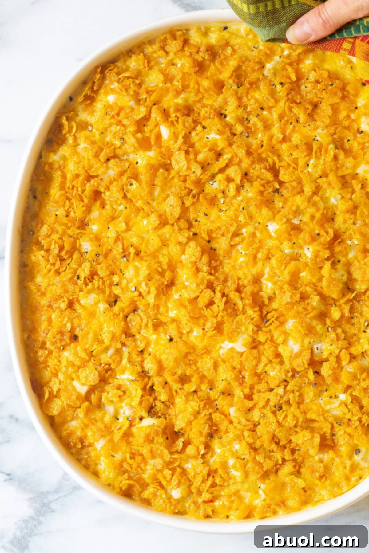 Freshly baked Company Potatoes with a perfect golden-brown, crispy cornflake topping, bubbling from the oven.