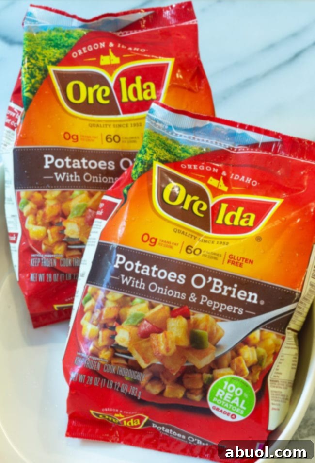 Close-up of a bag of Ore-Ida frozen hash brown potatoes, ready for thawing and mixing.