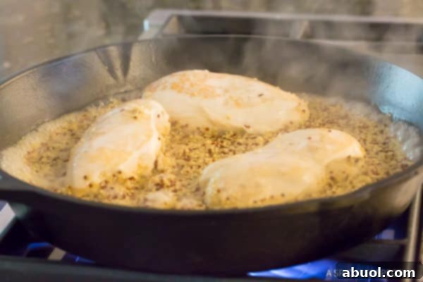 Make this Healthy One-Pot Quinoa with chicken cooking in the quinoa