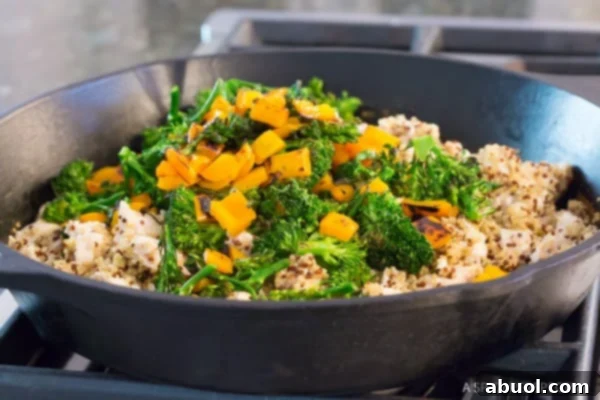 Chicken Broccoli Quinoa - adding sauteed vegetables to the pan