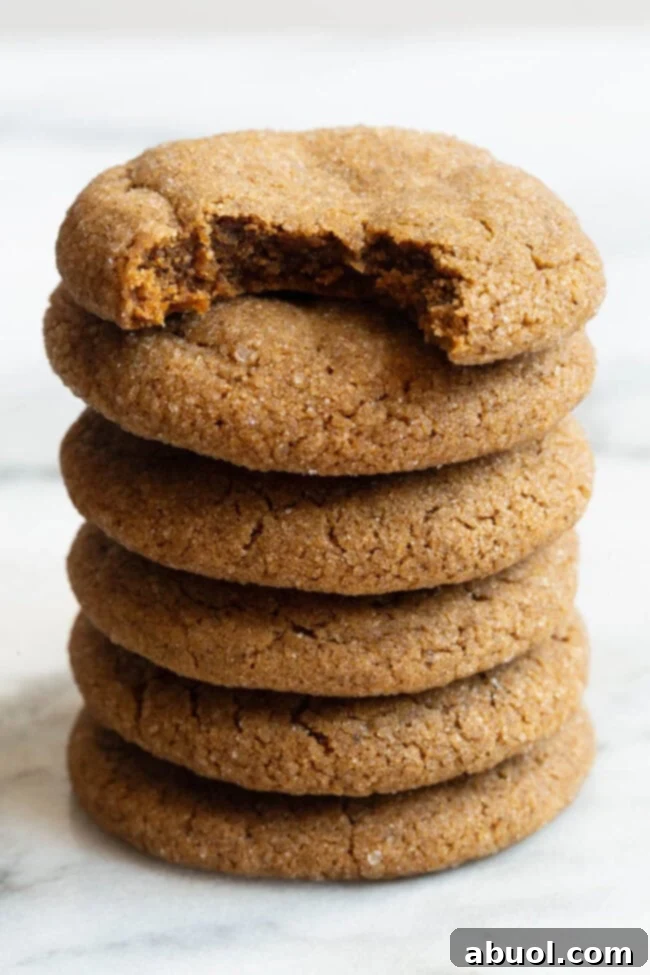Stack of freshly baked soft molasses cookies, dusted with sparkling sugar