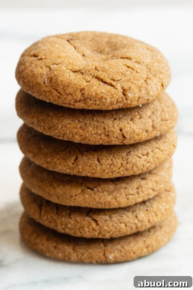 Stack of chewy soft molasses cookies, glistening with sugar