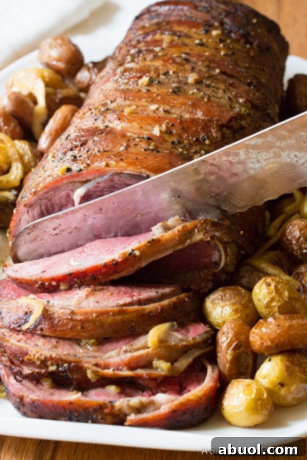 christmas dinner beef tenderloin made in the slow cooker - sliced on platter