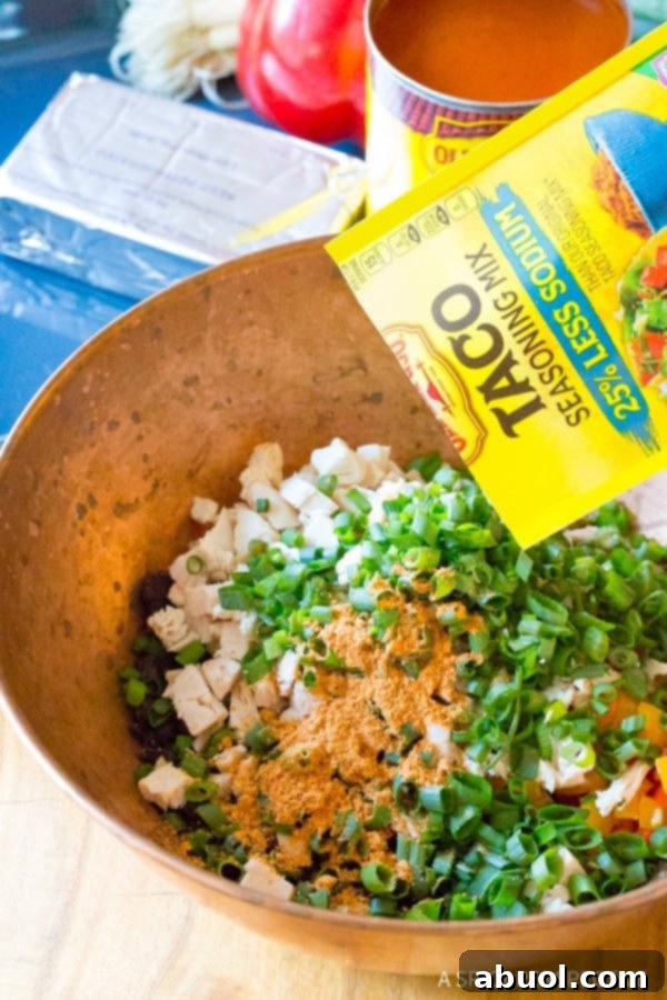 Filling for lasagna rolls in a mixing bowl. 