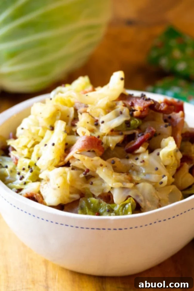 Delicious Irish Cabbage and Bacon Recipe – Perfect for St. Patrick's Day Dinner! A serving of vibrant Irish Bacon and Cabbage in a rustic bowl, garnished and ready to be enjoyed.