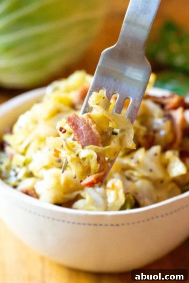 Incredible 5-Ingredient Irish Cabbage and Bacon Recipe for Any Occasion A close-up of tender, perfectly cooked Irish Cabbage and Bacon in a bowl, ready to be enjoyed.