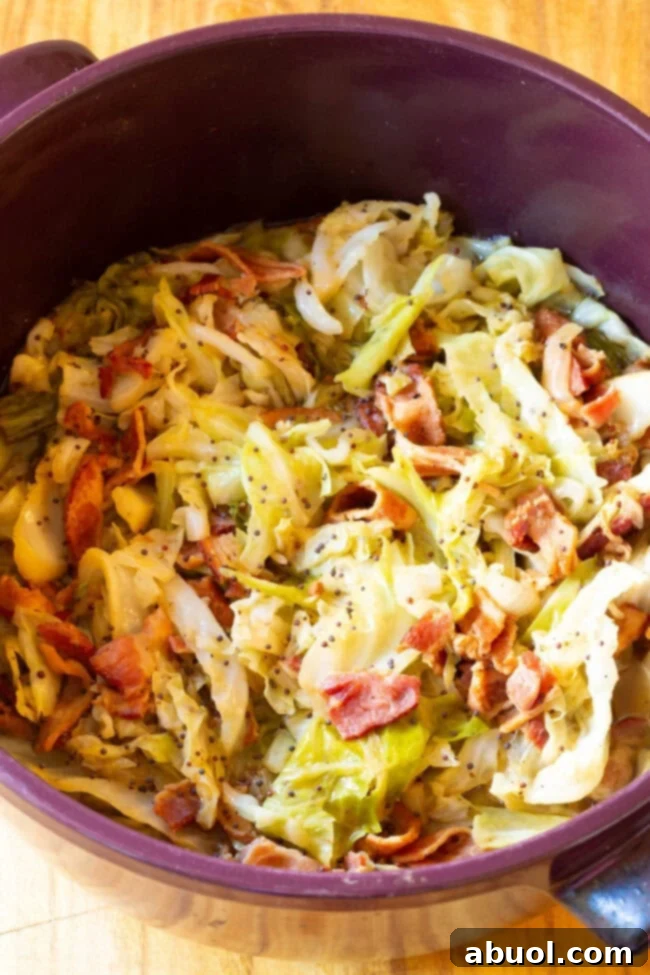 The Best 5-Ingredient Irish Cabbage and Bacon for a Quick and Delicious Meal A hearty portion of Irish Bacon and Cabbage, cooked to perfection and served in a bowl, capturing its rich colors and textures.