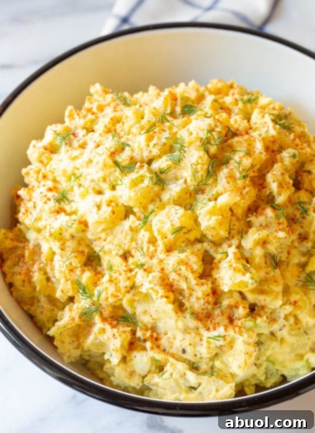 The best creamy potato salad recipe served in a large bowl, ready for a feast.