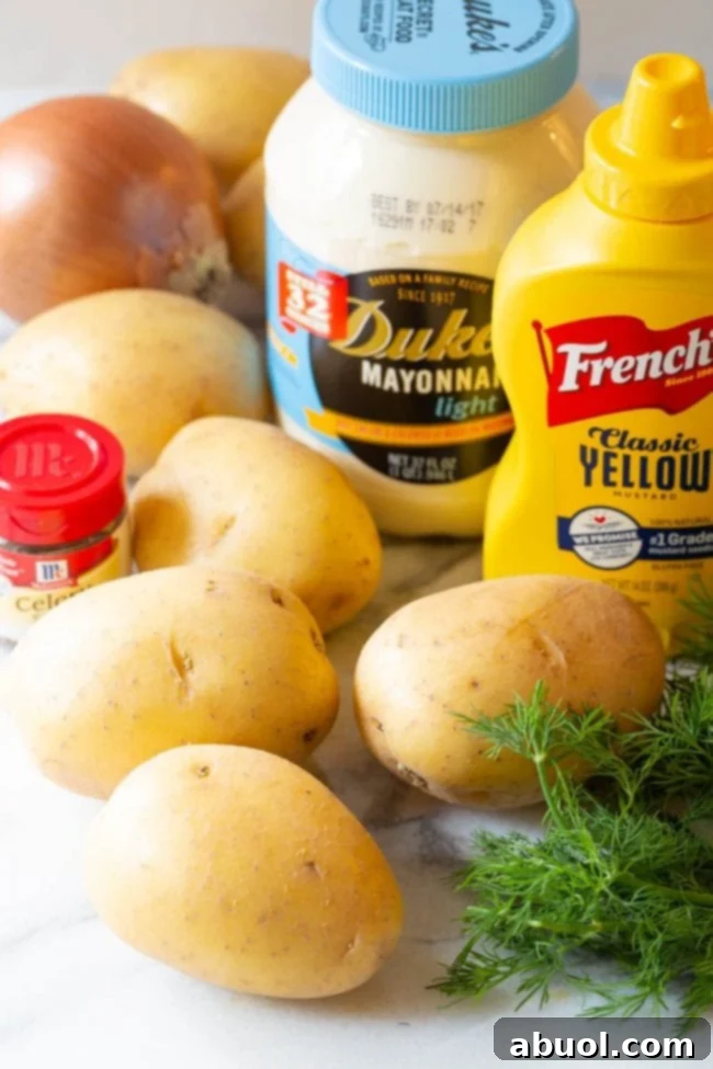 All the fresh ingredients laid out, ready to make the best potato salad recipe.