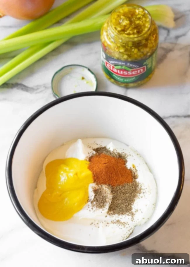 Creamy potato salad dressing in a bowl, showing its rich texture and color.