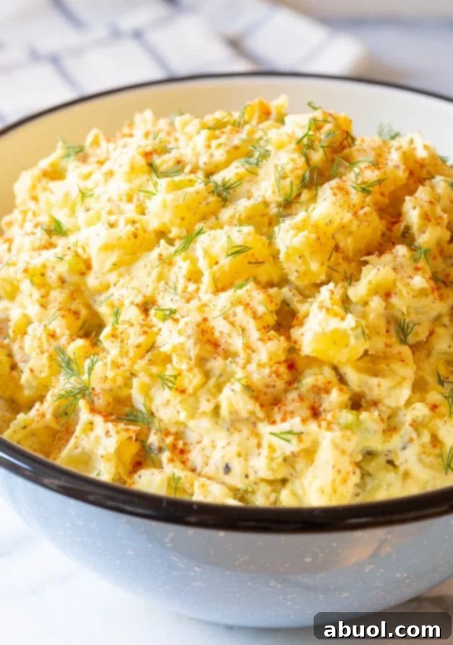 The finished product of my mom's famous creamy potato salad recipe, beautifully presented.