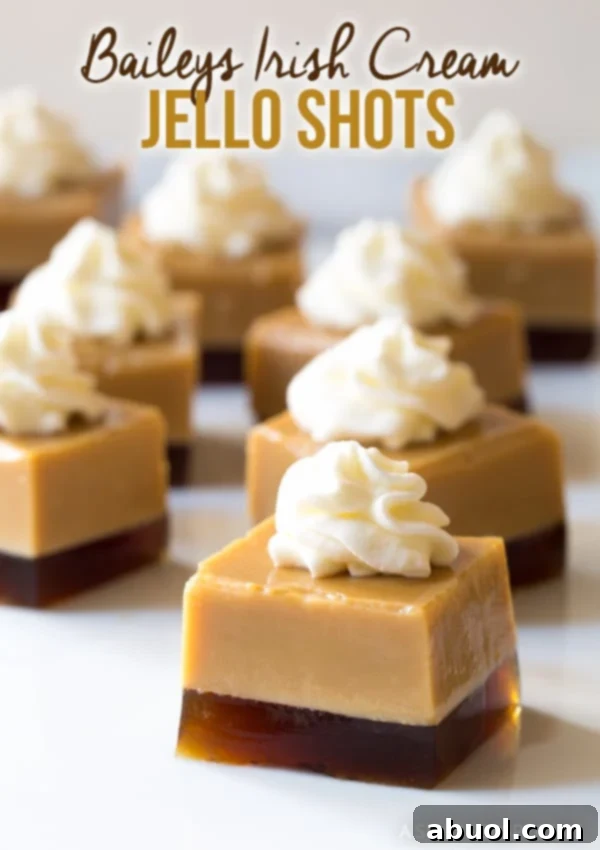 Delightful Baileys Irish Cream Jello Shots topped with fluffy whipped cream, perfect for St. Patrick's Day.